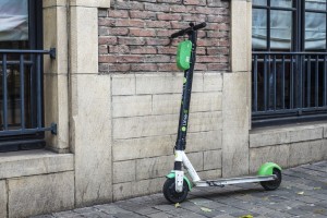 electronic scooter by the wall