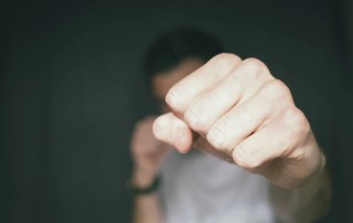 man punching with fist