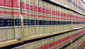 rows of legal books on library shelves