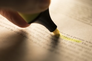 hand highlighting section in a legal book