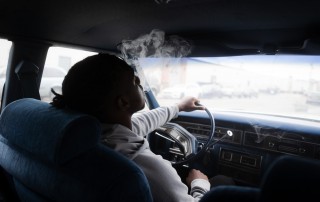 man-driving-and-smoking