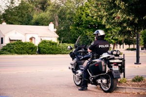 police riding on motorcycle