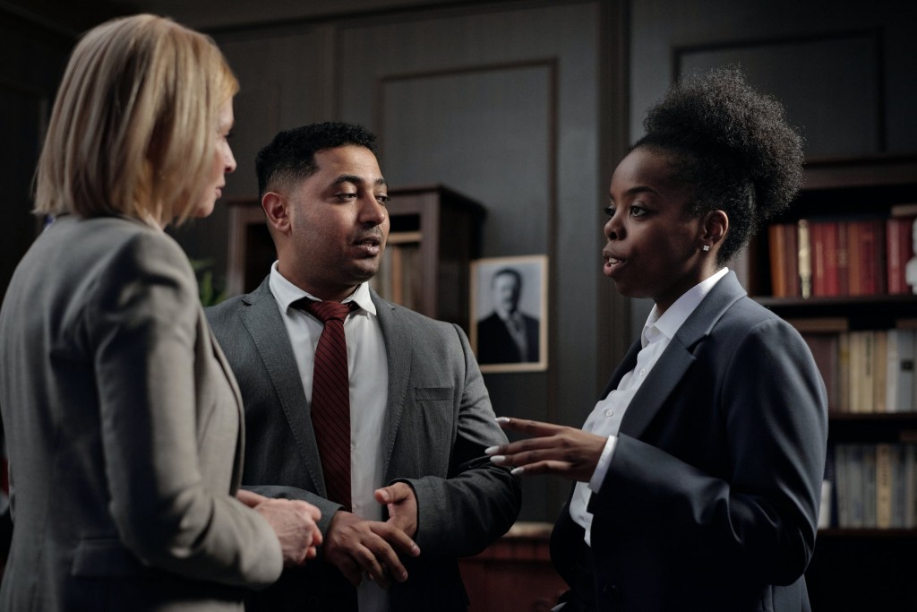 group of lawyers talking in office