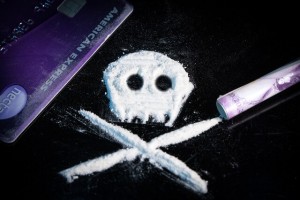 cocaine powder forming skull and bones