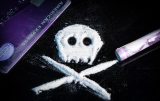 cocaine powder forming skull and bones