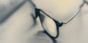 research concept image - glasses on top of open book