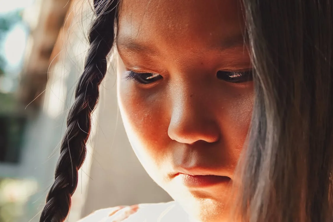 up-close view of sad young girl