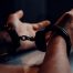 handcuffed hands with open palms